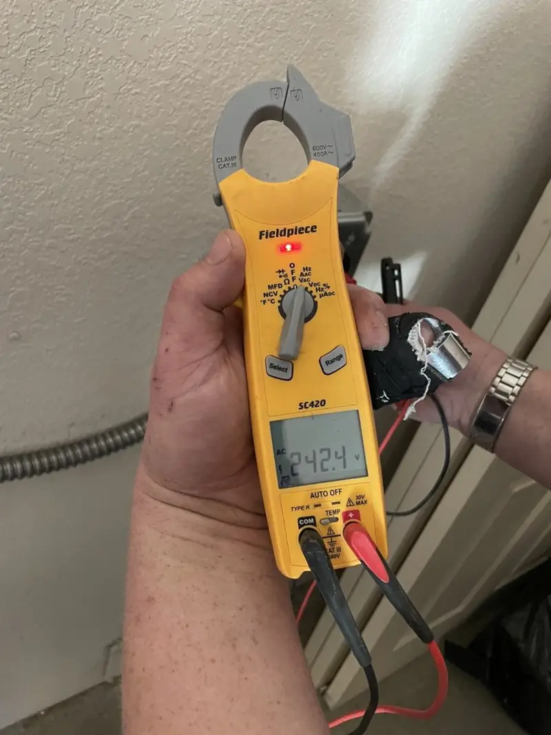 Voltage testing with clamp meter during Ceiling Fan Installation in Vincennes